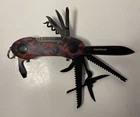 Munkees Multi-tool Red Camo Folding Knife With Bottle Opener And Other Tools Used. Price: $11.99.